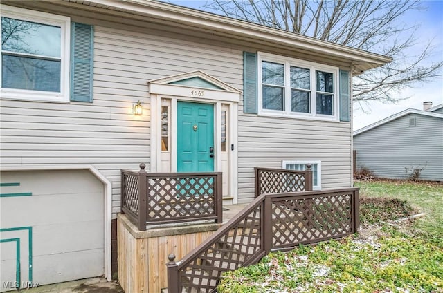 view of exterior entry with an attached garage