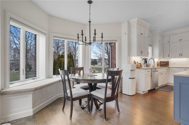 dining room featuring an inviting chandelier and wood finished floors