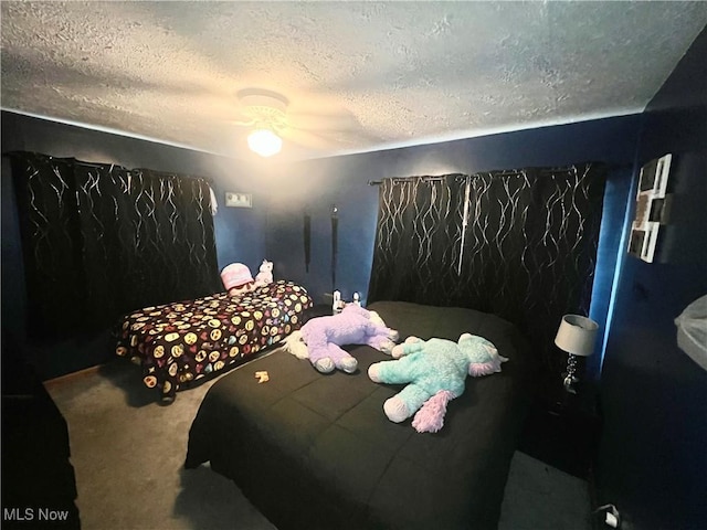 carpeted bedroom featuring a textured ceiling