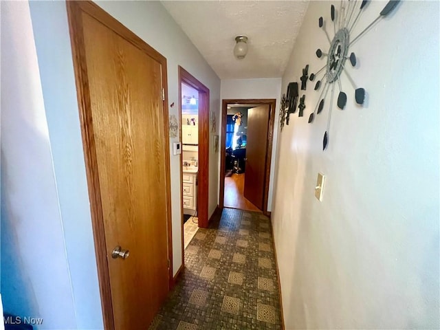hall featuring dark floors