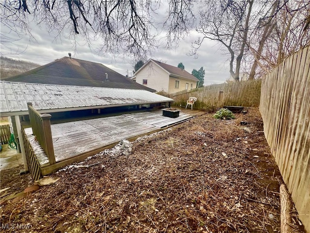 view of home's exterior featuring metal roof, a patio, and a fenced backyard