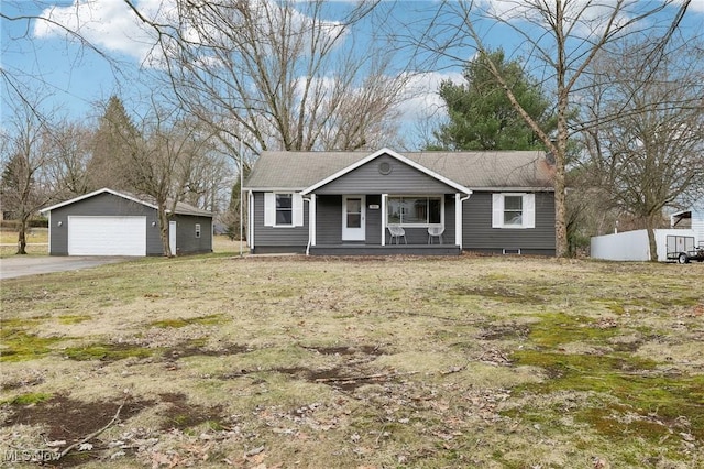 view of front facade featuring a garage, a porch, and an outdoor structure