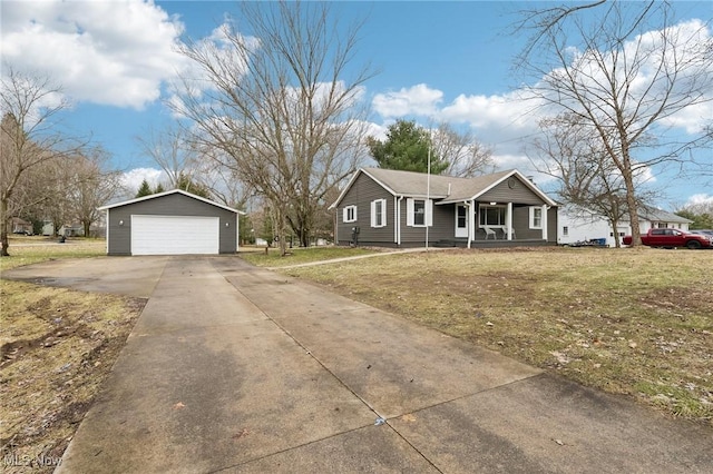 view of front of house with a garage, a front yard, and an outdoor structure