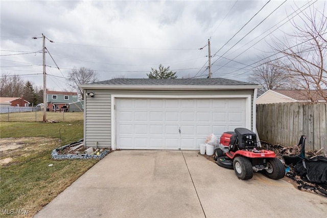 detached garage featuring fence