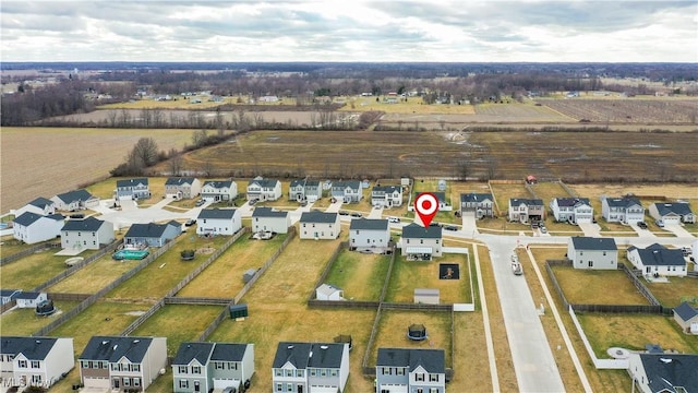 aerial view featuring a residential view and a rural view