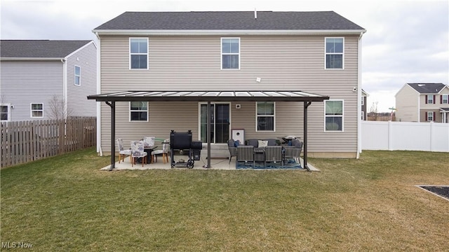 back of property with a patio, a lawn, a fenced backyard, and outdoor lounge area