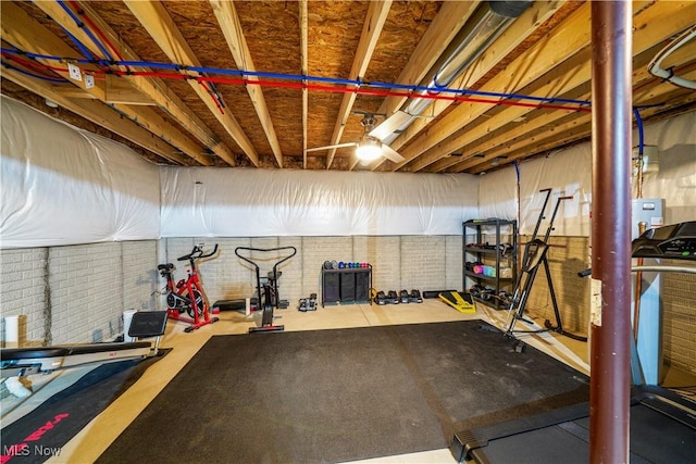 workout room with brick wall