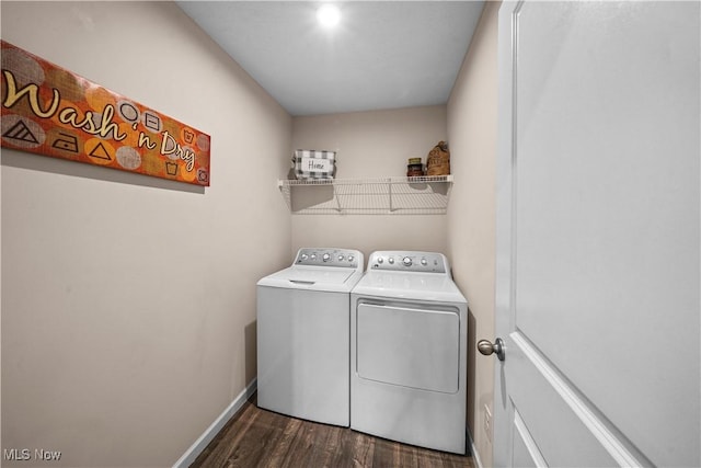 laundry room featuring dark wood-style floors, laundry area, independent washer and dryer, and baseboards