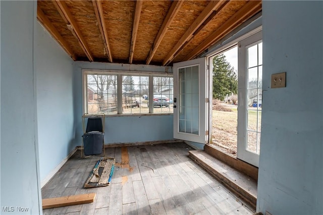 misc room with hardwood / wood-style floors and a healthy amount of sunlight