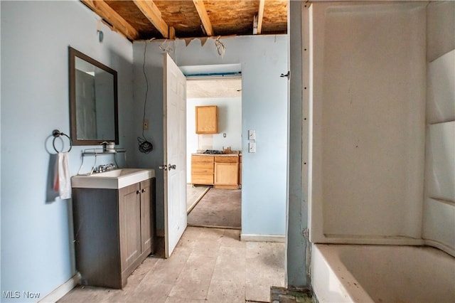 full bath featuring a bath and vanity