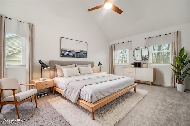 bedroom featuring lofted ceiling, ceiling fan, and light colored carpet