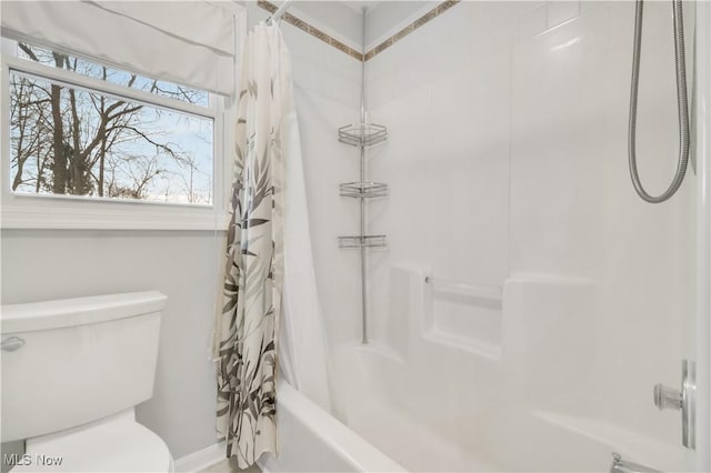 full bath featuring shower / bathtub combination with curtain and toilet