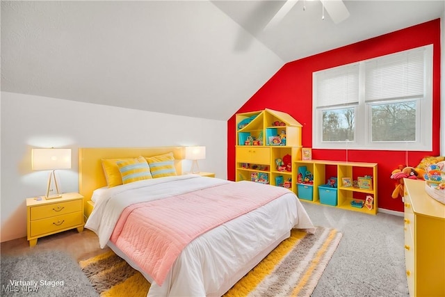 carpeted bedroom featuring lofted ceiling and ceiling fan