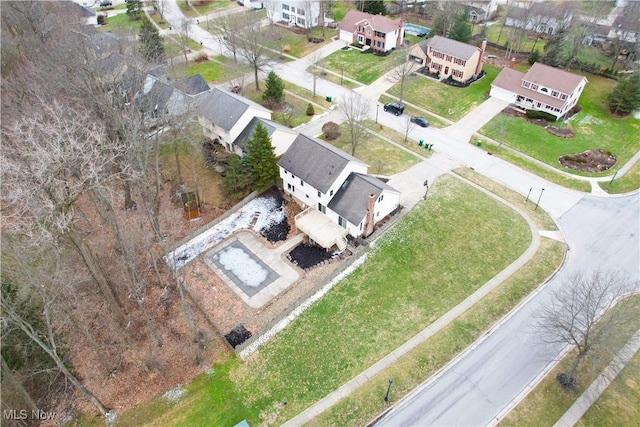 birds eye view of property with a residential view