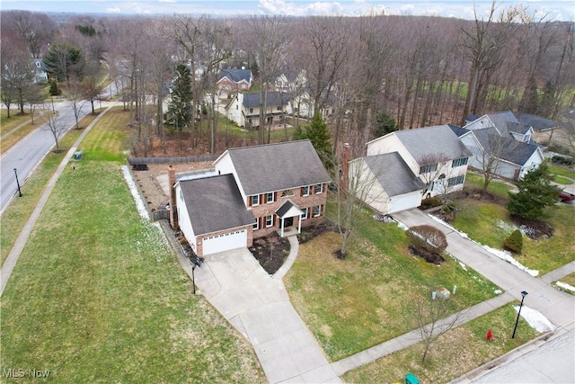 bird's eye view featuring a residential view and a view of trees