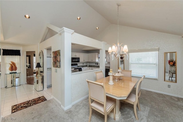 dining area with light carpet, light tile patterned floors, baseboards, and a notable chandelier