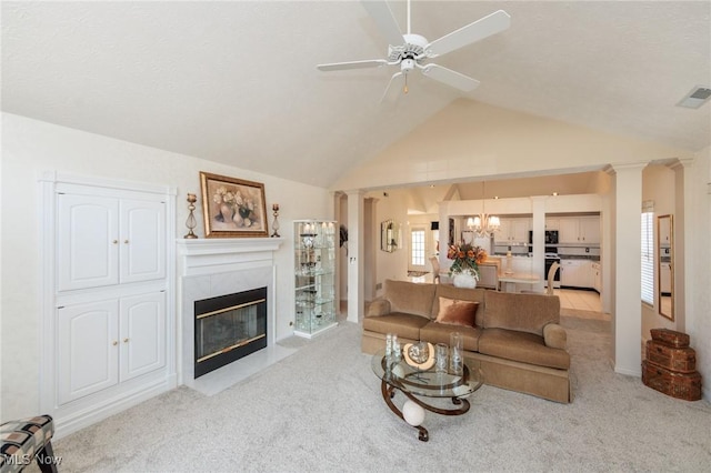 living room with carpet flooring, a high end fireplace, and ornate columns