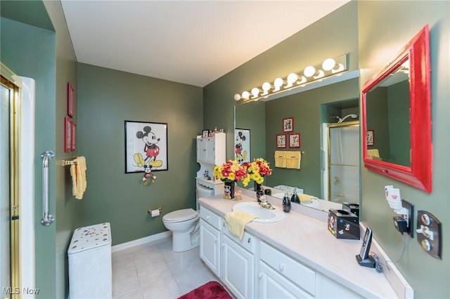 full bath with tile patterned flooring, toilet, vanity, baseboards, and an enclosed shower