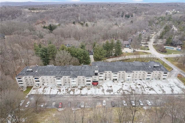 drone / aerial view featuring a view of trees