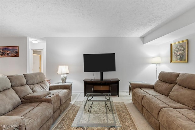 living room featuring a textured ceiling, baseboards, and light colored carpet