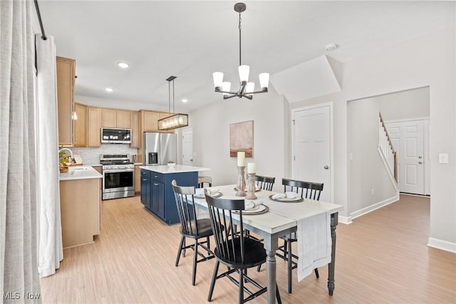 dining room with stairway, recessed lighting, light wood-style flooring, and baseboards