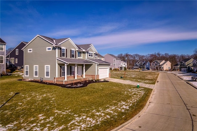 view of front of home featuring driveway, a porch, a front yard, and a residential view