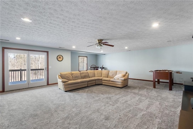 carpeted living room with recessed lighting, visible vents, and baseboards