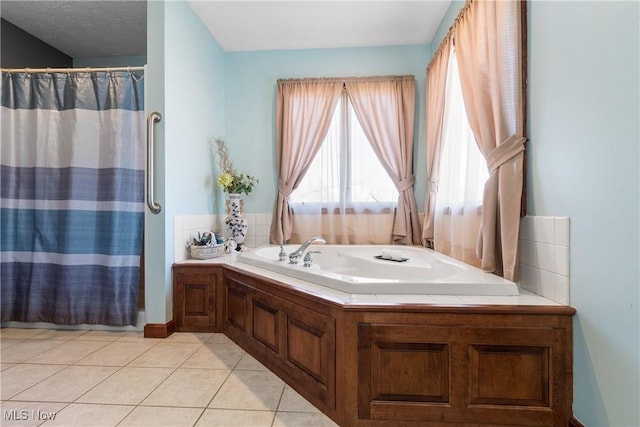 full bath featuring tile patterned flooring, a garden tub, and a shower with shower curtain