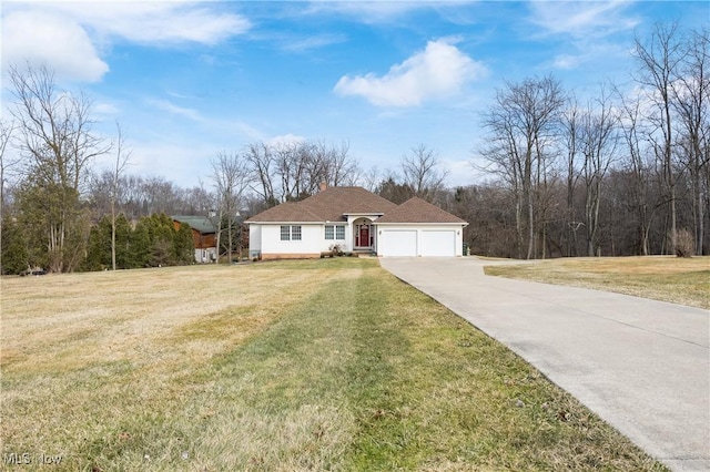 view of front of house with a front lawn, an attached garage, driveway, and a chimney