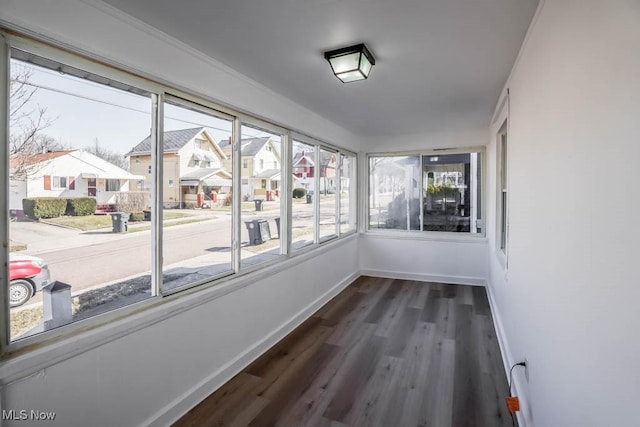 unfurnished sunroom featuring a residential view