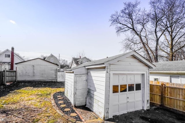 detached garage with fence