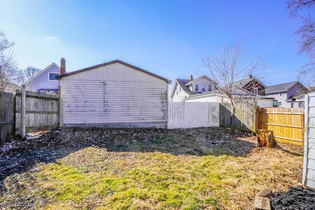 exterior space with a fenced backyard