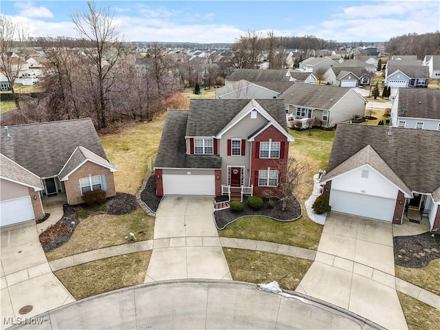 birds eye view of property with a residential view