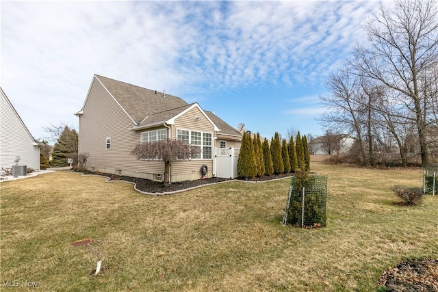 exterior space with a yard and central AC unit