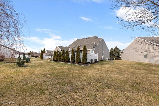 view of side of property featuring a lawn