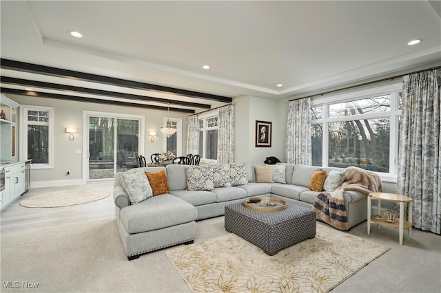 living area featuring recessed lighting, beam ceiling, and baseboards