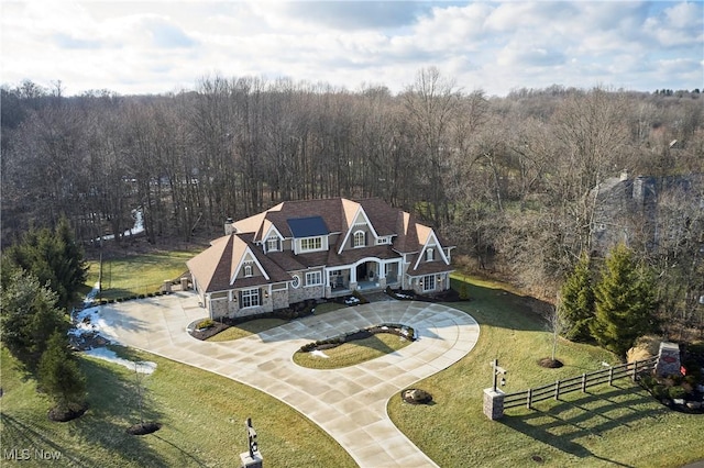 birds eye view of property with a wooded view