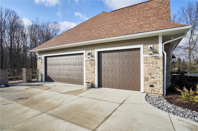 detached garage with a gate