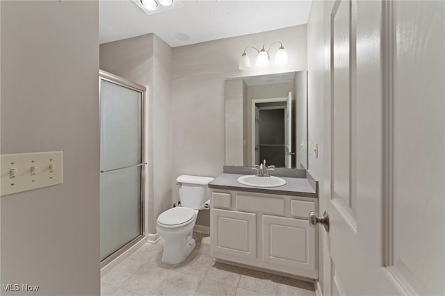 full bathroom with vanity, a stall shower, tile patterned flooring, and toilet