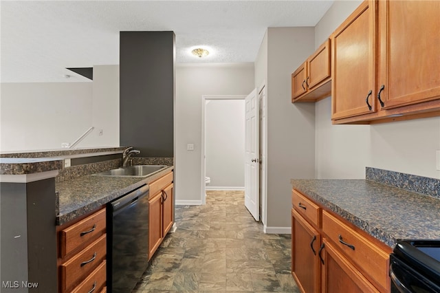 kitchen featuring dark countertops, brown cabinetry, a sink, dishwasher, and baseboards