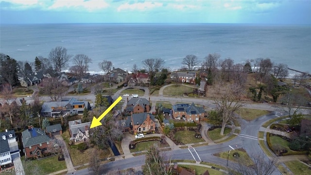 bird's eye view featuring a residential view and a water view