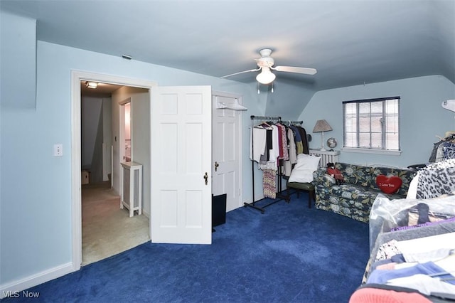 bedroom featuring lofted ceiling, ceiling fan, and dark colored carpet