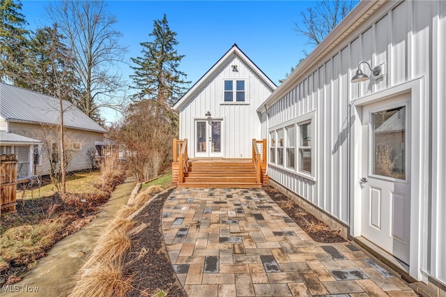 view of property exterior featuring french doors and board and batten siding