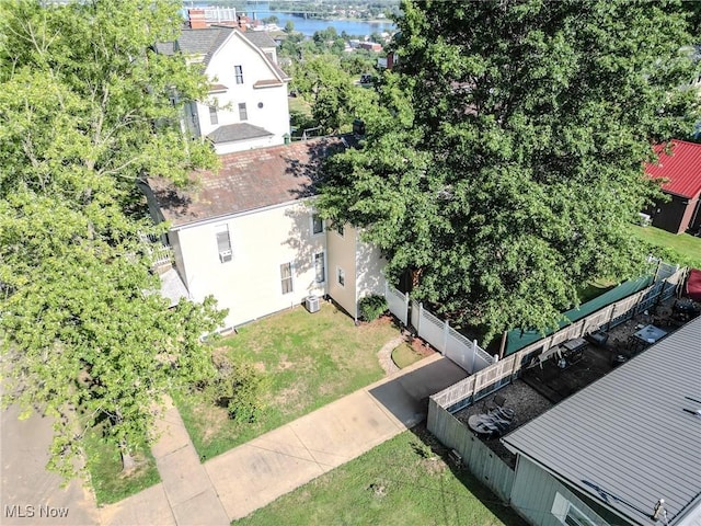 birds eye view of property with a water view