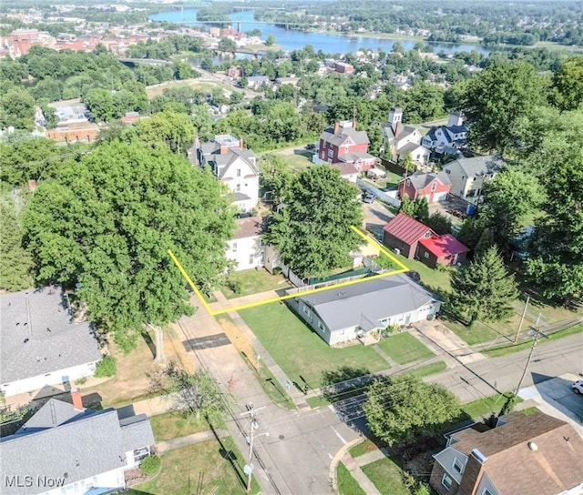 bird's eye view featuring a water view and a residential view