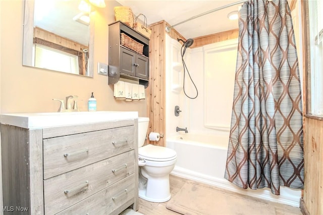 full bathroom with shower / tub combo, vanity, and toilet