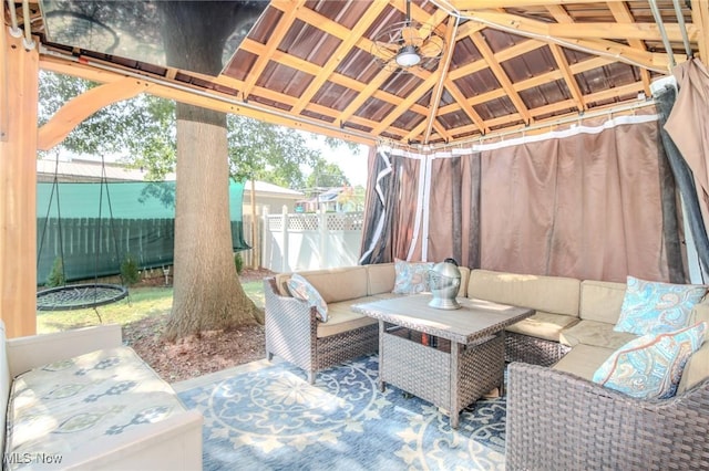 view of patio / terrace with an outdoor hangout area, a gazebo, and fence