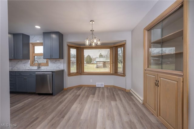 kitchen with visible vents, a baseboard radiator, light wood-style flooring, stainless steel dishwasher, and a sink