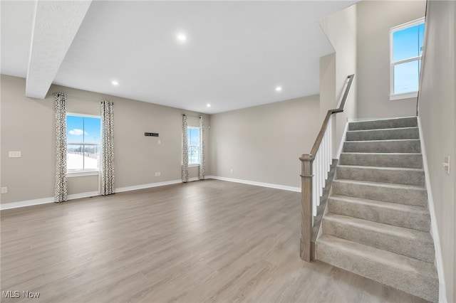 entryway featuring stairs, baseboards, wood finished floors, and recessed lighting