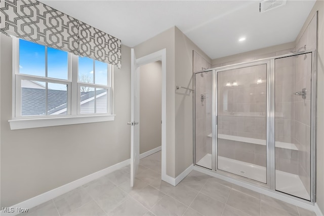 full bath with visible vents, a shower stall, baseboards, and tile patterned floors